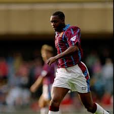 With a jubilant aston villa fan entering the pitch while holding an umbrella to celebrate with atkinson. Remembering Dalian Atkinson 7500 To Holte