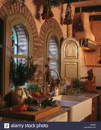 wooden shutters on arched windows above