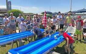 annual july 4th raingutter regatta watermellon man family