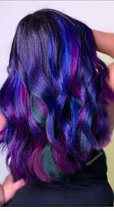 Those curls add movement to the style and the blend of pink with blue make the ombre appear so light and airy. Purple Hair Almost Oilslick Hair Purple Hair Blue Green Hair Hair Color Pink