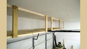 Diy network offers smart solutions for storing large items, like bikes, kayaks and surfboards, in the garage. Storage Above The Garage Door Free Woodworking Plan Com