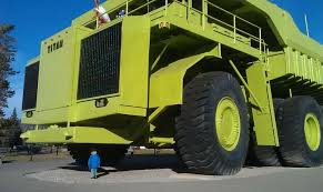 One Of The Biggest Trucks In The World Little Human For A Scale Dumptruck Mining Truck Titan Heavy Equipment Giant Truck Trucks