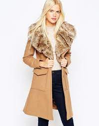 A good choice if you live in a warmer climate but still want the look of a winter coat. Asos Coat In A Line Fit With Faux Fur Collar And Belt At Asos Com Asos Coat Outwear Fashion Belted Coat