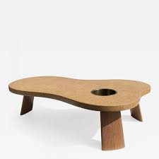 The designs were inspired by modern gallery spaces and using beautifully crafted timber as a subtle but vibrant feature in a room. Paul Frankl Organic Shape Cork And Mahogany Coffee Table