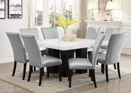 A rectangular table would be best for seating 10 people. Camila Brown Square Marble Top Dining Set W 8 Chairs Silver Pu Ivan Smith Furniture