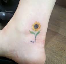 I love the color green used on the leaves. 50 Amazing Sunflower Tattoo Ideas For Creative Juice