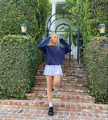 I want to be buried in chokers, crop tops and tennis skirts. Emma Chamberlain Tennis Skirt Outfit White Tennis Skirt Fashion Inspo Outfits