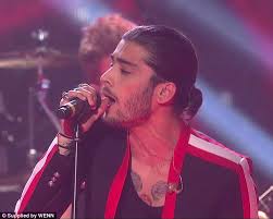 Guys who want to give their undercut a gentleman's touch will adore this hairstyle. Zayn Malik Sports Slicked Back Ponytail As 1d Perform On X Factor Final Daily Mail Online