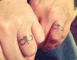 78 Wedding Ring Tattoos Done To Symbolize Your Love Tattoo Wedding Rings Wedding Band Tattoo Wedding Ring Tattoo