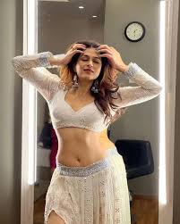 Shraddha Das flaunts her fine sexy midriff in this white outfit - see now.  - SpideyPosts