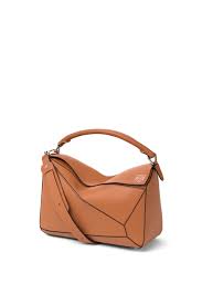 Carried by everyone from kate moss to sarah jessica parker, the bag is precisely. Puzzle Bag In Classic Calfskin Tan Loewe