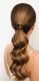 The ponytail shown here is separated into thirds: These Ponytail Hairstyles Will Take Your Hairstyle To The Next Level