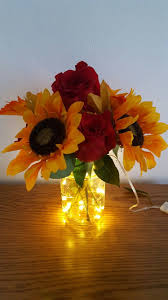 Rustic Sunflower Mason Jar Centerpiece With Submersible Fairy Light Strin Sunflower Wedding Decorations Sunflower Wedding Centerpieces Sunflower Themed Wedding