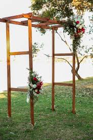 She decorates with inexpensive wildflowers and branches which also hold up better than hydrangeas or. Uncover Wood Project How To Build A Wooden Wedding Arch