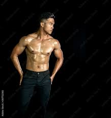 Asian muscle men posing muscle front on the black background. Body gym big  chest and shoulder and bicep. Healthy fitness body type. Stock Photo |  Adobe Stock