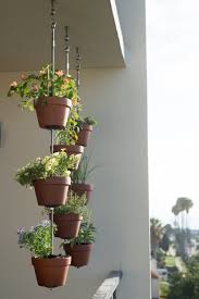 Brighten up your deck or balcony with this easy to make planter box! Vertical Garden Ideas Hanging Clay Pots For Your Plants The Horticult