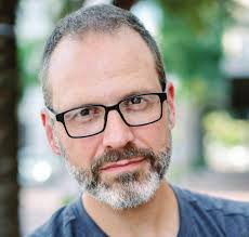 Parade grand marshal has stories to tell