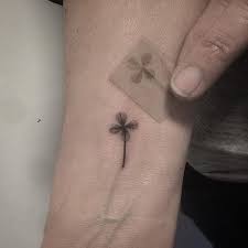 Clover leaf tattoo on right arm. Tiny Four Leaf Clover Tattoo Tattoogrid Net