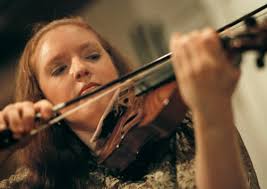 Interviewing violinist Rachel Barton, cellist Wendy Warner, and Suzuki-Orff  instructor Peggy Wise in preparation for a benefit concert at the James R.  Thompson Center