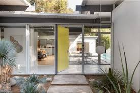 It also features colored glass and plexiglass, shiny metallic accents, and striking decorative prints. Modern Homes With Colorful Front Doors Dwell