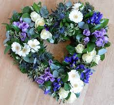 Funeral arrangements and tributes at this difficult time, we can at least make choosing, ordering and sending funeral flowers a little easier for you. Blue Lilac Funeral Heart Flowers Wreaths Chelmsford Florists