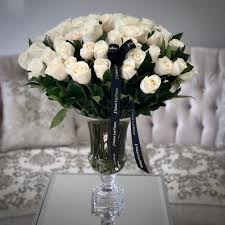 75 jlf white roses in a gl vase
