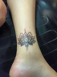 This intricate tattoo design of a lotus flower is just perfect. Wonderful Black Mandala Flower Tattoo On Left Ankle Flower Tattoo On Ankle Flower Tattoo Small Lotus Tattoo