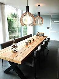 eettafel timber met kruisframe met prachtige lampen van secto design tafel van de betoverde beautiful dining rooms dining room table decor dining room table