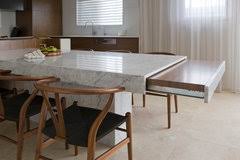 A seeded glass and brass cluster chandelier finish the dining space while blue shaker cabinetry frames the perimeter design. Hybrid Kitchen Island Table Yay Or Nay