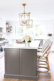 Copper effect handles, solid rustic oak block worktop, white marble effect backboard, clear glass splashback, oak engineered real wood flooring, lamona grey granite. My Kitchen Remodel Reveal Driven By Decor