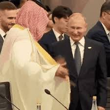 Though the actual moment is his inauguration, you have to wonder what music was going in the background as he was walking towards his destiny. Saudi Arabia S Crown Prince And Vladimir Putin Laugh And Clasp Hands At G 20 Summit