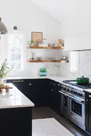 Modern kitchen counter and cabinets with granite counters, white cabinets, cook top, subway tile back splash. Non White Farmhouse Kitchens Seeking Lavender Lane