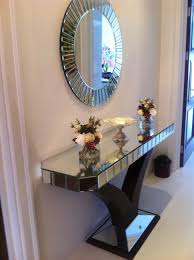 The table features a wooden table top with a sturdy metal frame. Our Best Selling Quartz Console And Mirror Set Look Stunning In Ms Hussain S Hallway Get Yours Here Http Shr Hall Console Table Corner Decor Entryway Decor