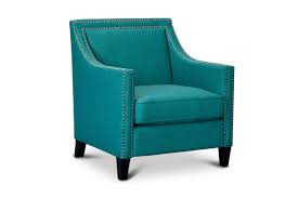 Two turquoise blue pod chairs paired with a gray pouf sit in front of a covered patio furnished with a gray wicker sofa accented with turquoise blue pillows and placed on a gray teak floor facing a gray wicker ottoman. Elsinore Accent Chair Teal Modern Accent Chairs Apt2b