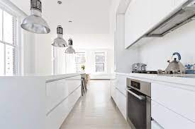 The cabinets are made of stainless steel and the space is equipped with a miele oven cooktop. Res4 Resolution 4 Architecture Wadia Residence Modern Nyc Apartment