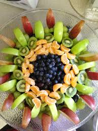 Decorative Fruit Salad Started With Grapes Boarded It With Green Apples And Red Pears In The Middle I Put K Edible Food Food Carving Christmas Salad Recipes