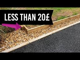 Create a clear divide between gravel, grass, soil, and stone with garden border edging. Easy Lawn Edging Installation Garden Wood Edge Ideas Youtube