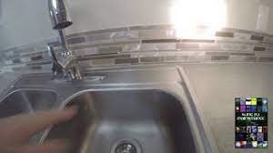 The dw drain water gets pumped up (in the hose) and it has to fall down after that, by gravity. Dishwasher Needs Air Gap But Sink Does Not Have Hole How Plus Why To Tie Up Drain Line Youtube