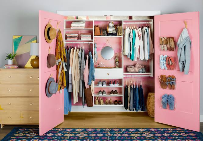 Small closet with double hanging rods maximizing vertical space