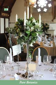 Wedding Table Flowers In 2020 Candleabra Wedding Centerpieces Wedding Table Centerpieces Wedding Table