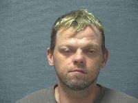 Minerva man found passed out in car with gun, drugs