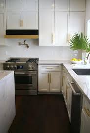 Stacked White Shaker Kitchen Cabinets Painted Benjamin Moore Intense White Are Accented White Shaker Kitchen Cabinets Shaker Kitchen Cabinets Kitchen Cabinets