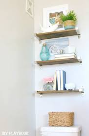 What should i do with a small bathroom? How To Style Bathroom Shelves Above The Toilet Diy Playbook