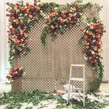 A Garden Trellis Wall With Romantic Clusters Of Roses Trellis Wedding Backdrop Wedding Trellis Diy Wedding Backdrop