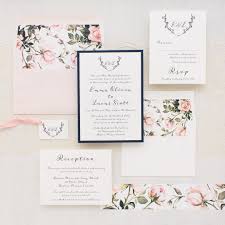 A mixture of bold typography and swirling calligraphy in white stand out elegantly against a black background, ensuring every word stands out in your guests' eyes. Garden Roses Wedding Invitations Blush Navy Beacon Lane