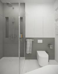 Framing the mirror gives the space more movement and makes the ceiling seem higher. A Suitable Simple Small Bathroom Designs Looks So Perfect And Spacious With A Smart Decor Ideas In It Gray And White Bathroom Simple Small Bathroom Designs White Bathroom Interior