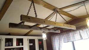 A rustic farmhouse kitchen features crisp white shaker cabinets, white tile backsplash, stainless steel appliances, farmhouse sink and open shelving to farmhouse sink is custom made from pietra cardosa. Mobile Home Gets Rustic Farmhouse Kitchen Makeover Mobile Home Living
