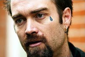 It usually signifies a violent act against another and most times a murder. Black Filled Teardrop Tattoo Near Right Eye