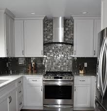 A chalkboard wall in the kitchen could not be a simpler kitchen accent wall idea. Decorative Tile Accent Behind Wall Mount Range Hood Transitional Kitchen Milwaukee By Elite Home Renovations Sterling Home Designs Houzz