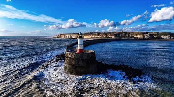 Newhaven lighthouse and harbour arm in Britain